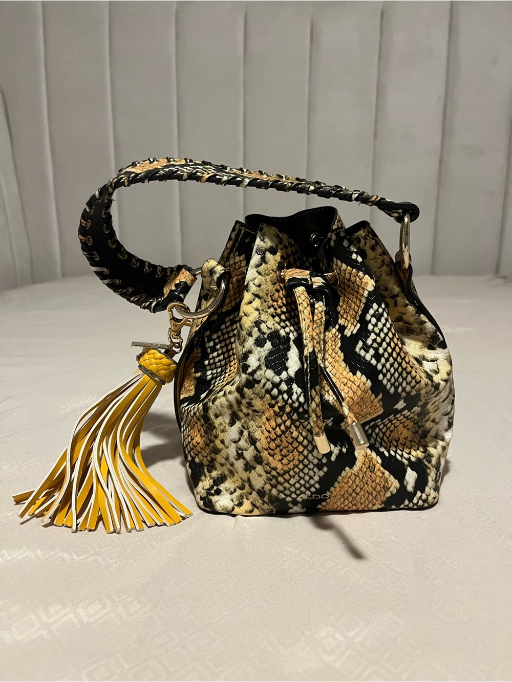 Aldo Snake-Print Mini Dorothy Drawstring Bucket Bag with Yellow Tassel